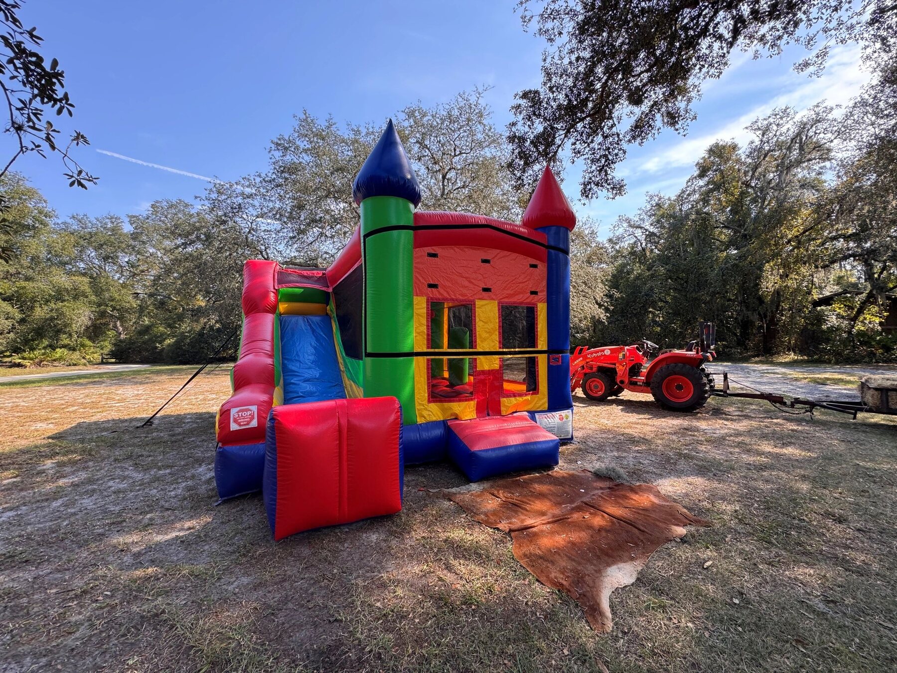 Colorful castle combination bounce house with slide