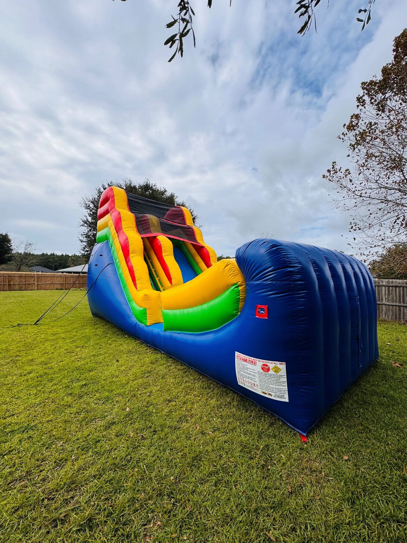 Colorful inflatable half-pipe water slide