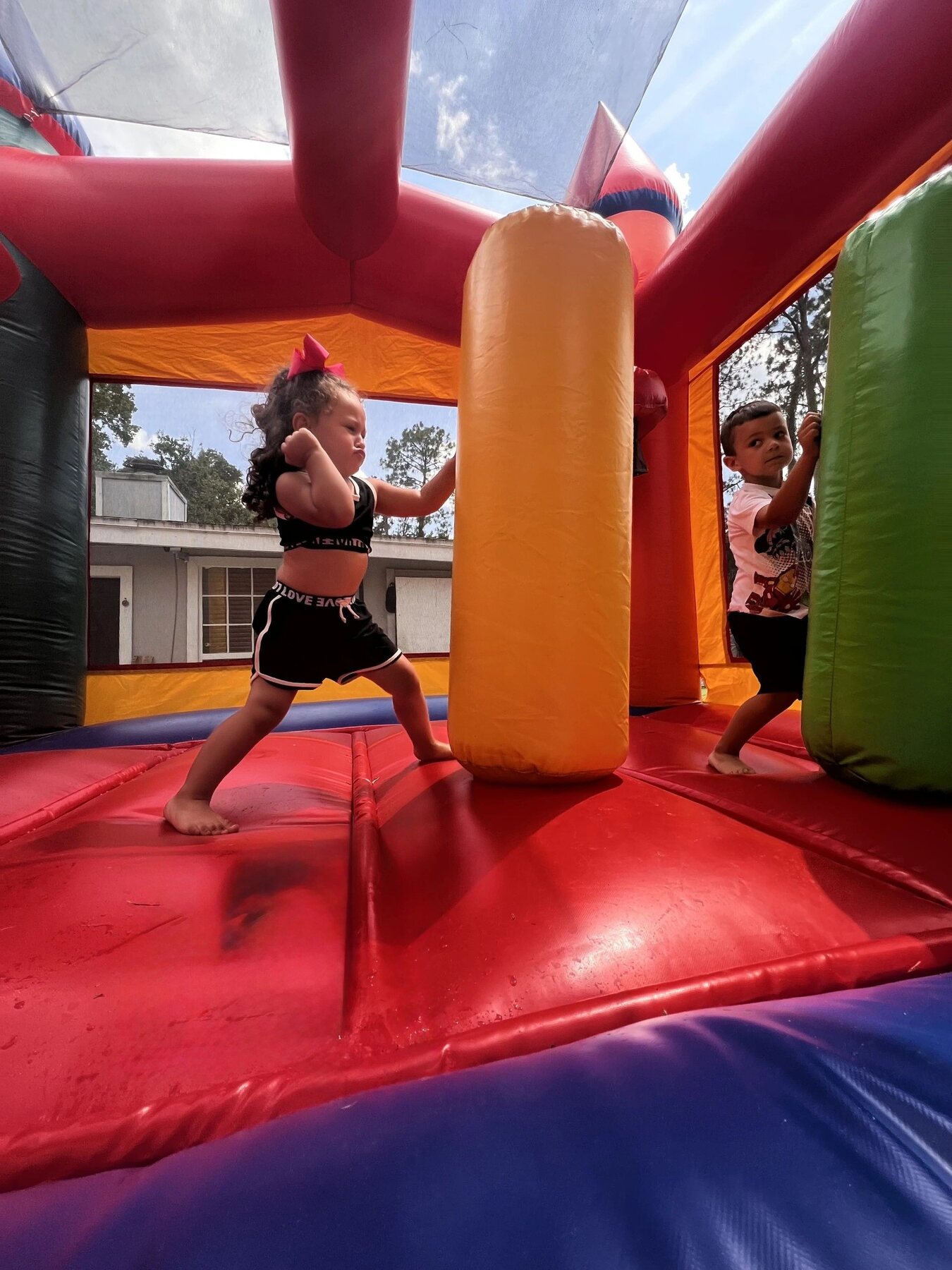 Children enjoying a colorful bounce house