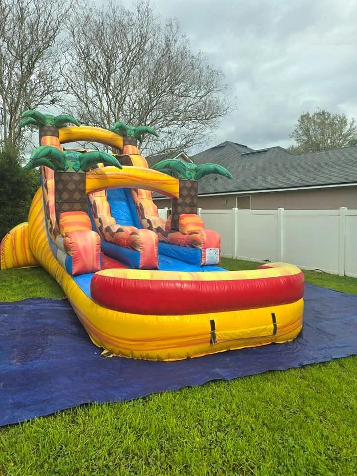 Tropical inflatable slide with splash pool
